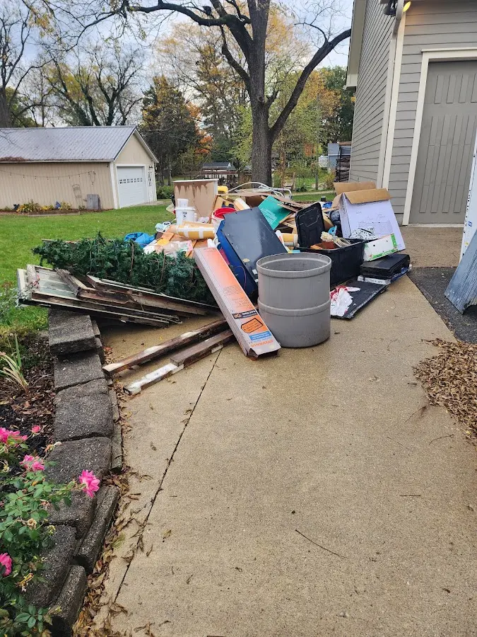 Dumpster being loaded with debris for Roofing Dumpster Rental in Twinsburg